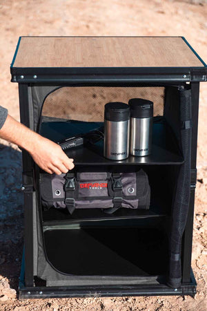 De-fiance folding camp table in use